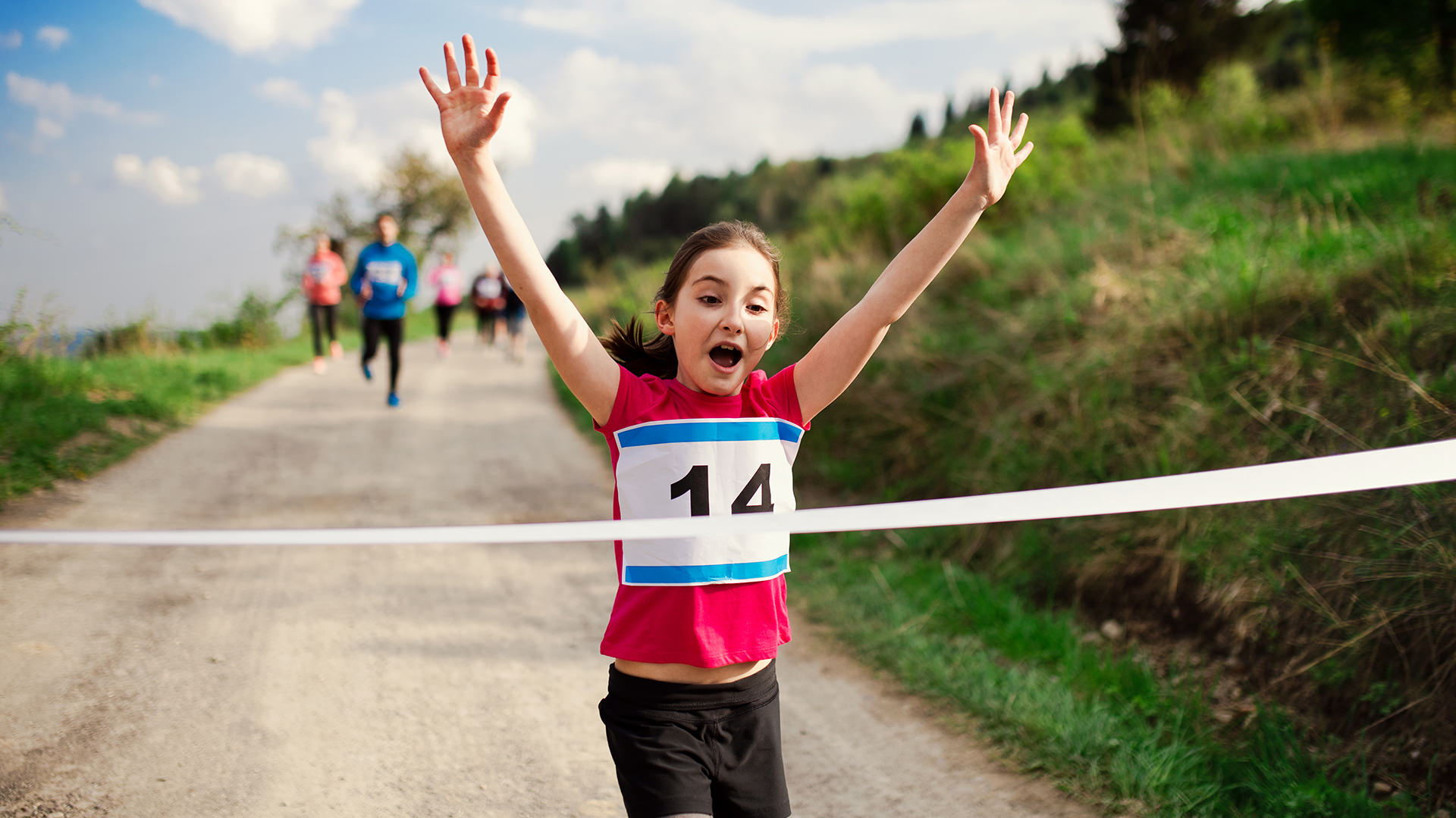 child winning running race