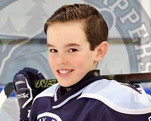 Noah in his hockey uniform