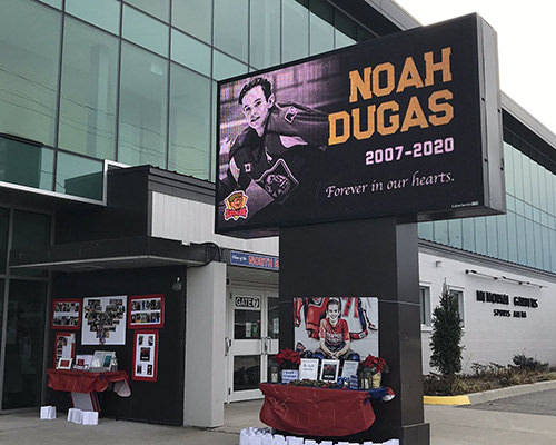 A memorial set up in front of a North Bay rink